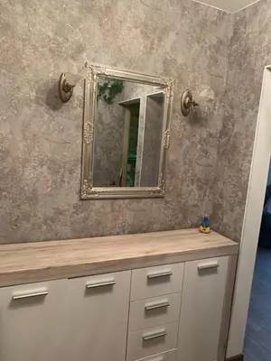 a bathroom with a mirror on the wall at Vytauto 36a in Zarasai