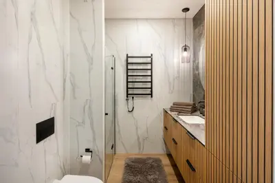 a bathroom with a shower and a toilet and a sink at Žalia kopa in City center in Vilnius