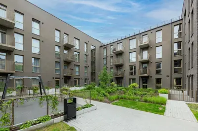 an apartment building with a courtyard at Žalia kopa in City center in Vilnius