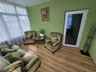 a living room with a couch and chairs and a table at Apartamentai keliaujantiems į Kauna in Garliava