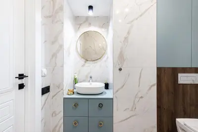 a bathroom with a sink and a mirror at One-Bedroom Traku Street Apartment by Reside Baltic in Vilnius