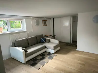 a living room with a couch and a window at Elpo House in Neveronys