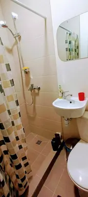 a bathroom with a shower and a sink at EirForce1 in Kaunas