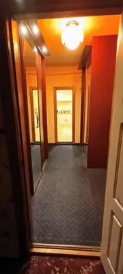 an empty hallway with a mirror in a room at EirForce1 in Kaunas