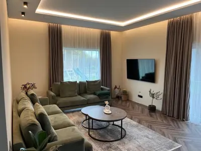 a living room with a couch and a table at Cotta in Karkazai