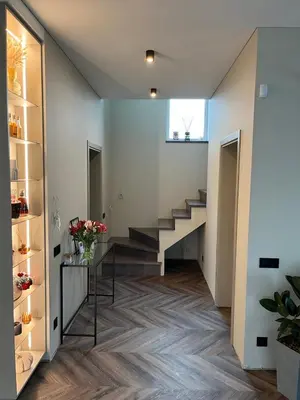 a hallway with a staircase in a house at Cotta in Karkazai