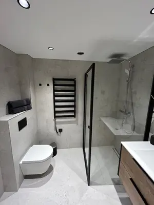 a bathroom with a toilet and a shower and a sink at Studio 11 - old town Kaunas in Kaunas
