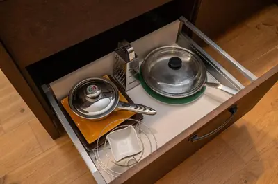 an overhead view of a kitchen with two pots and pans at Spacious Apartment In Vilnius Old Town by Reside Baltic in Vilnius