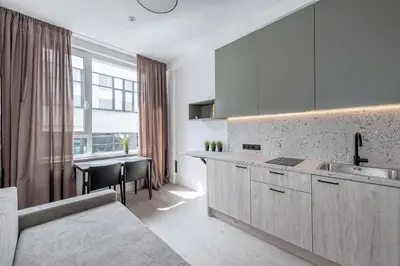 a kitchen with a sink and a counter top at P-ONE APARTMENTS - Self Check-in in Vilnius