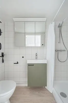 a bathroom with a sink and a toilet and a tub at P-ONE APARTMENTS - Self Check-in in Vilnius
