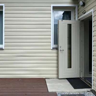 an open door on the side of a house at Čiurlionio 14 in Kaunas