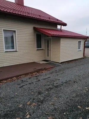 a house with a porch and a driveway at Čiurlionio 14 in Kaunas