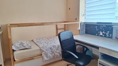 a room with a desk and a computer and a chair at Butas1 in Vilnius