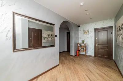 a hallway with a large mirror on a wall at Svečių namai Imperija in Šiauliai