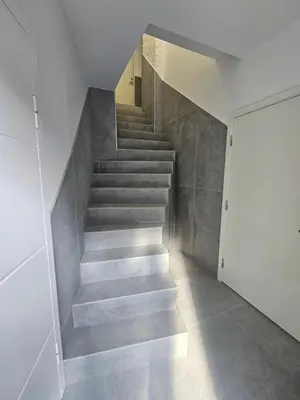 a staircase in a house with a stair case at VV apartamentai in Kaunas