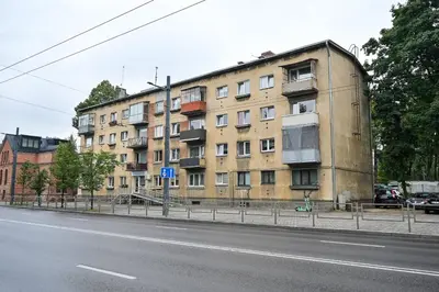 a large building on the side of a street at Cozy Coner Apartments in Kaunas