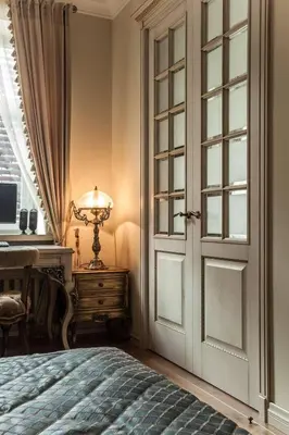 a bedroom with a bed and a desk and a window at Boutique Classic Apartment in Kaunas Center in Kaunas
