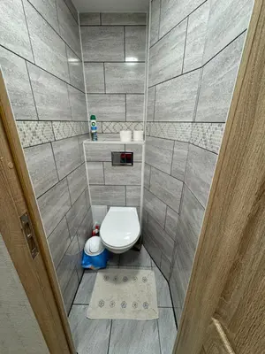 a small bathroom with a toilet in a room at Baltijos Apartment in Kaunas