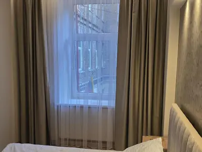 a window with a view of a city at Cozy & Silent Apartment in Vilnius