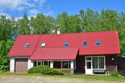 a house with a red roof at Lauryno sodyba in Suviekas