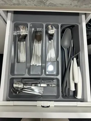 a tray with utensils in a drawer at SILVIA apartment 101 in Druskininkai