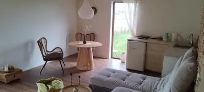 a living room with a couch and a table at Mango namelis in Žuvininkai
