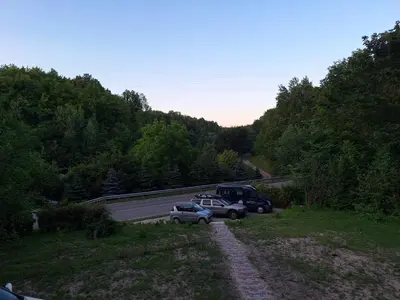 a couple of cars parked on the side of a road at Rent Olamit in Karkazai