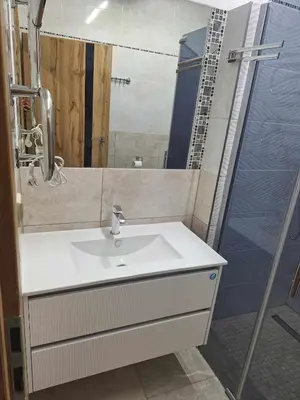 a bathroom with a sink and a shower at Rent Olamit in Karkazai