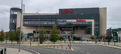a building with avs sign on the side of a street at Ozas Park Apartments in Vilnius