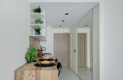 a dining room with a table and chairs at Zveryno apartment in Vilnius