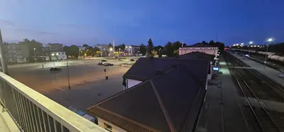 a view of an empty parking lot at night at Platforma2b in Šiauliai