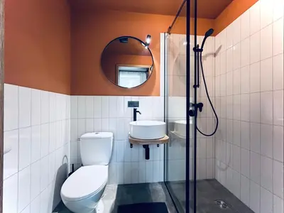 a bathroom with a toilet and a sink at Platforma2b in Šiauliai