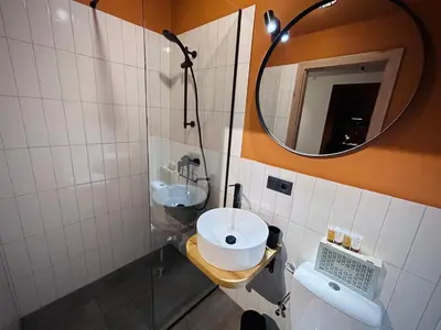a bathroom with a sink and a mirror at Platforma2b in Šiauliai