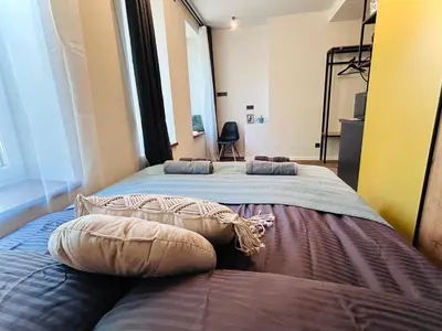 two beds in a room with two pillows on them at Platforma2b in Šiauliai
