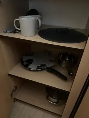 a shelf with a cup and a plate on it at A5 apartment in Vilnius