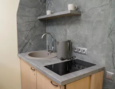 a kitchen counter with a sink and a sink at A5 apartment in Vilnius