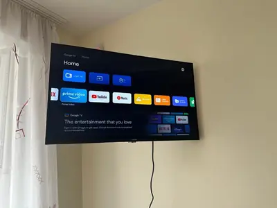 a flat screen tv hanging on a wall at A5 apartment in Vilnius