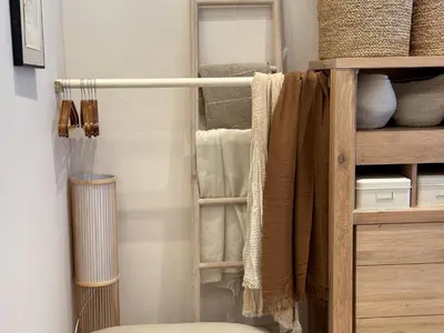 a room with a closet with towels and a shelf at IVIS House Lakeside Retreat in Vilnius in Vilnius