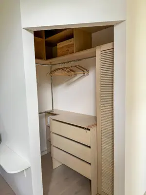 a kitchen with a closet with a wooden drawer at IVIS House Lakeside Retreat in Vilnius in Vilnius