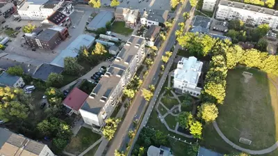 an overhead view of a city with buildings and trees at SunCity Apartment in Šiauliai
