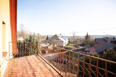 a balcony with a view of a city at Angelica Apartment in Vilnius