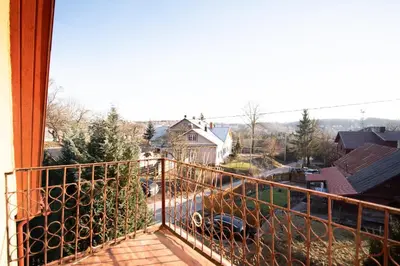 a balcony with a view of a city at Angelica Apartment in Vilnius