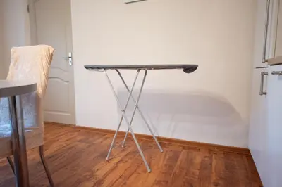 a table in the corner of a room at Angelica Apartment in Vilnius