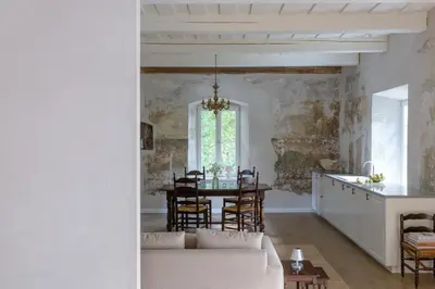 a living room with a couch and a table at Aštriosios Kirsnos dvaras in Aštrioji Kirsna