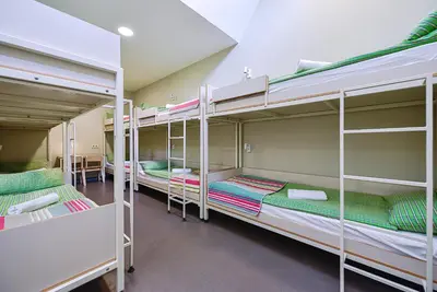a group of bunk beds in a room at Nykščio Hostel in Anykščiai