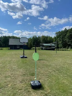 a tennis racket and a goal in a field at Marga Pieva in Inturkė