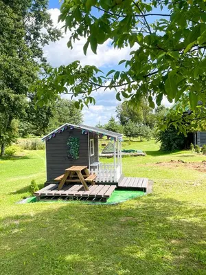a small shed with a picnic table in a field at Marga Pieva in Inturkė