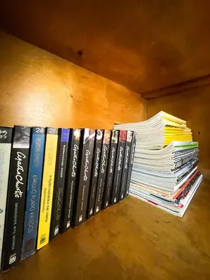 a bunch of books sitting on a shelf at Marga Pieva in Inturkė