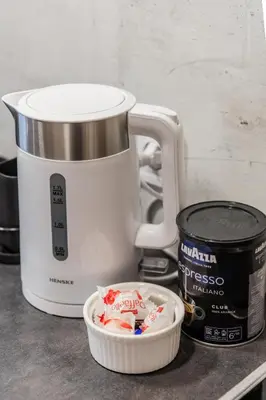 a food processor and a container on a counter at Fox studio mezzanine in Šiauliai
