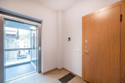 an empty room with a door and a window at Butukas dviems in Vilnius